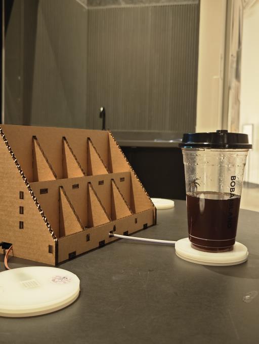 A drink placed beside the installation electronics